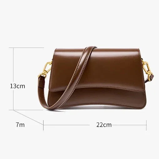 Brown leather shoulder bag with gold hardware, 22x13x7cm, on white background