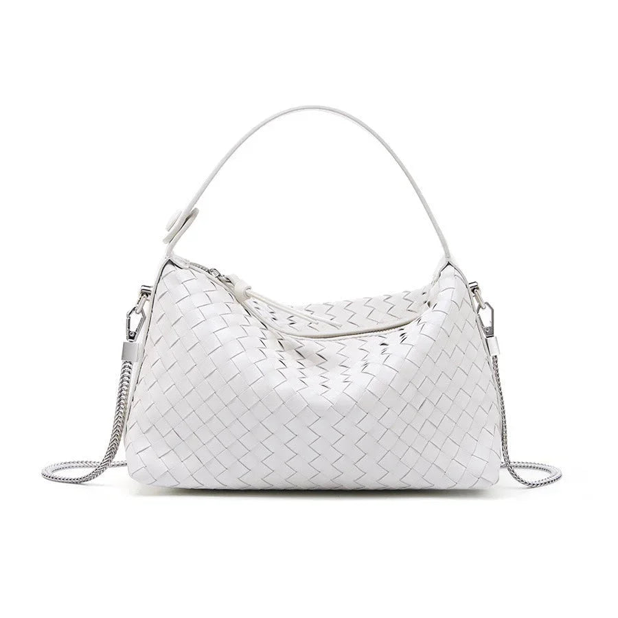 White woven leather handbag with a top handle and detachable silver chain strap