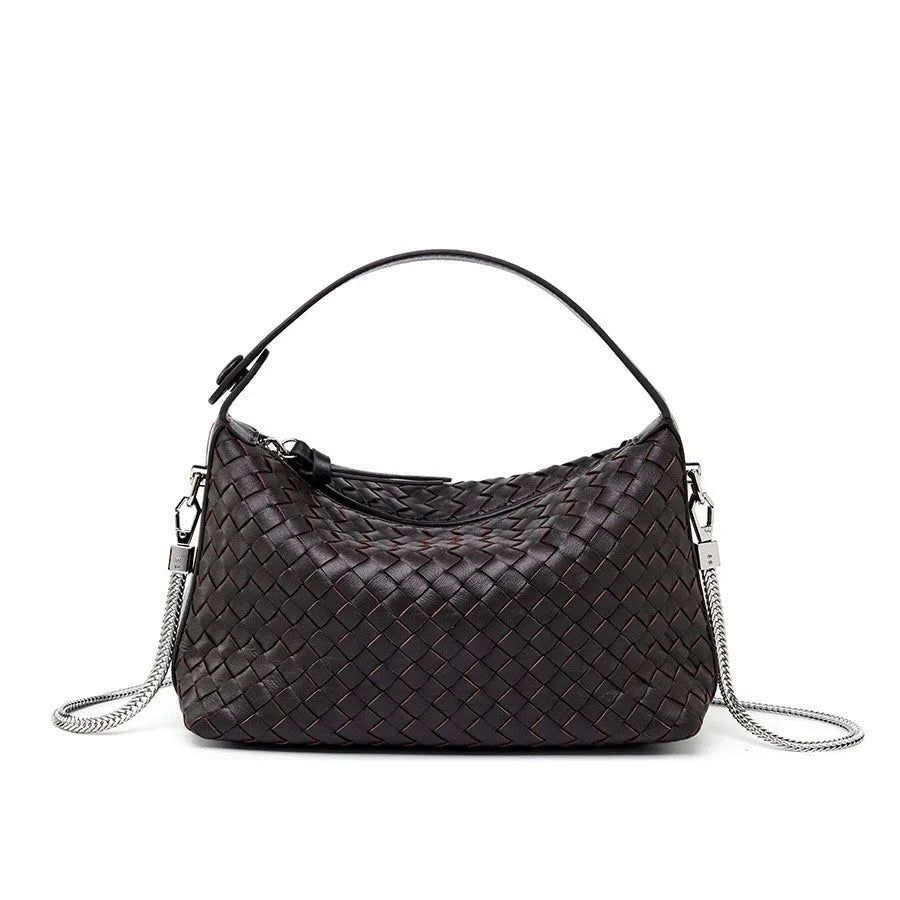 Black woven leather shoulder bag with silver chain strap on white background