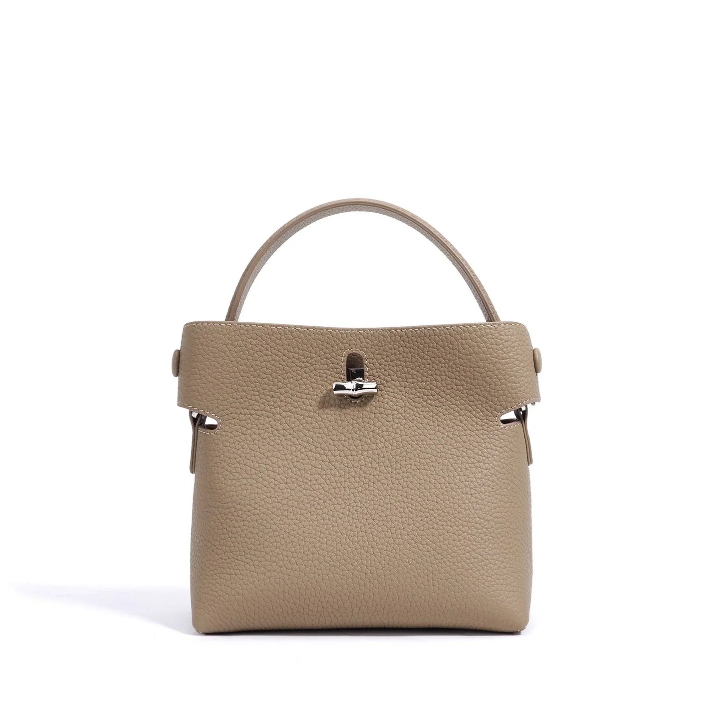 Taupe pebbled leather top handle handbag with silver hardware on white background