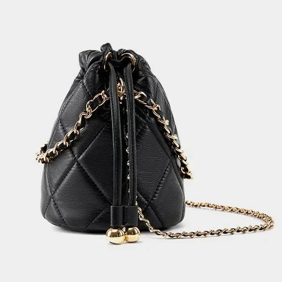 Black quilted leather drawstring bag with gold chain strap on white background