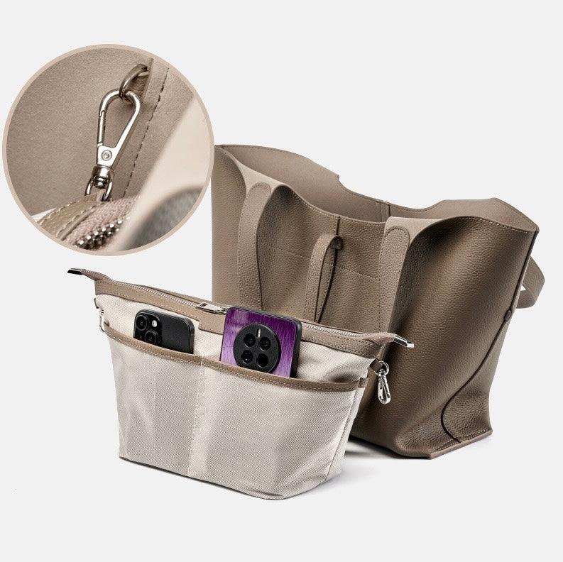 Beige tote bag with organizer insert, phones in pockets, and close-up of metal clasp.