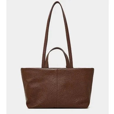 Brown leather tote bag with dual handles on a plain white background