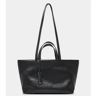 Black leather tote bag with double handles and gold accent, stylish minimalist handbag