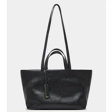 Black leather tote bag with double handles and gold accent, stylish minimalist handbag