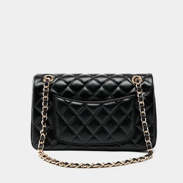Black quilted leather handbag with gold chain strap and back pocket on white background