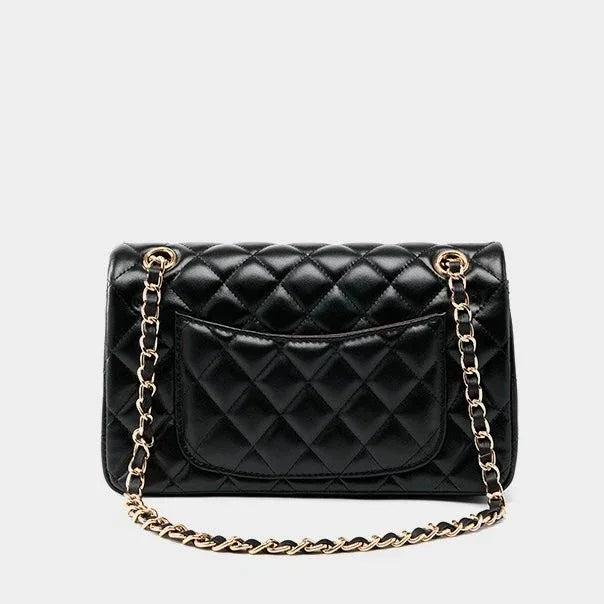 Black quilted leather handbag with gold chain strap and back pocket on white background