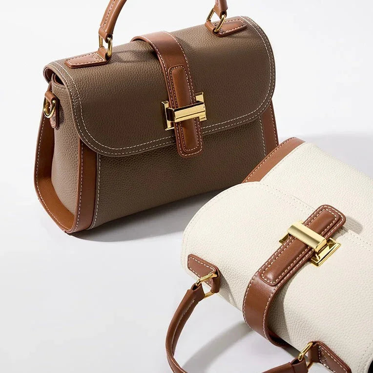 Two leather handbags with gold buckles, one brown and one white, on a white background