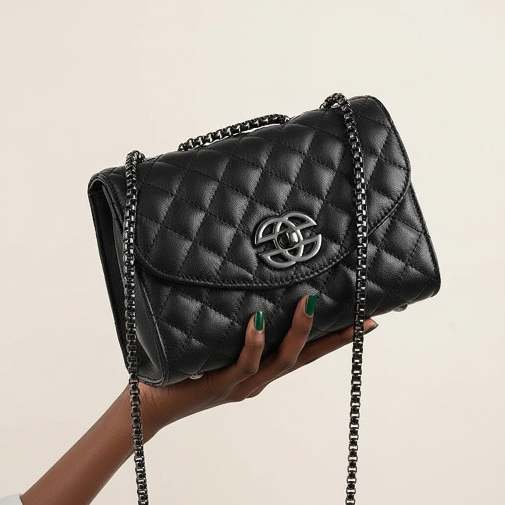 Black quilted leather shoulder bag with chain strap and silver logo clasp