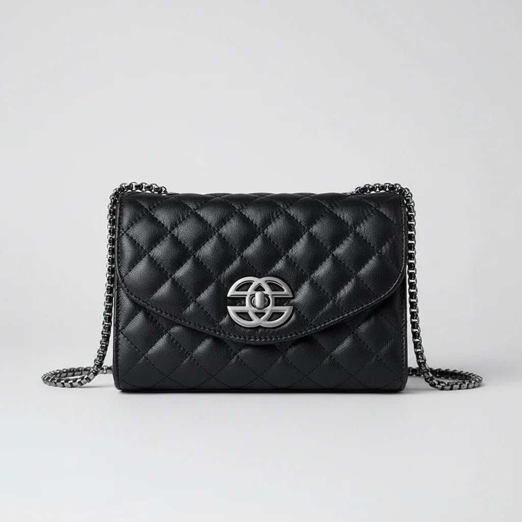 Black quilted leather shoulder bag with silver chain strap and metallic logo clasp