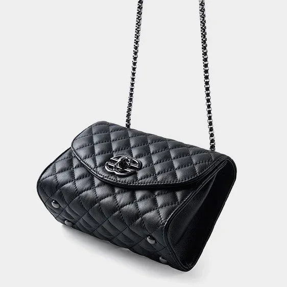 Black quilted leather shoulder bag with chain strap on white background