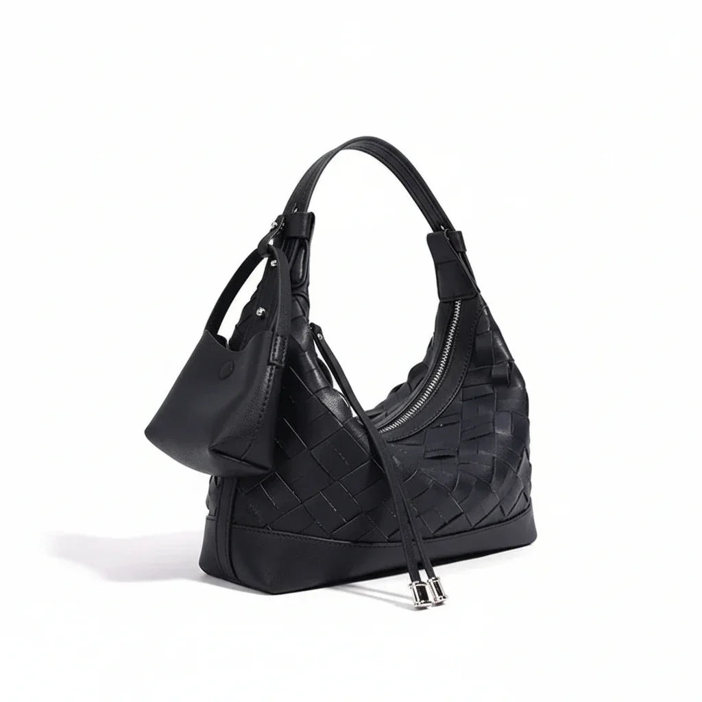 Black woven leather hobo bag with zip closure and detachable pouch on white background