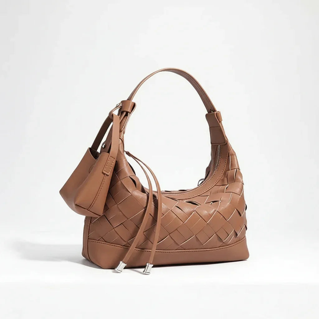 Brown woven leather shoulder bag with a small pouch against a white background