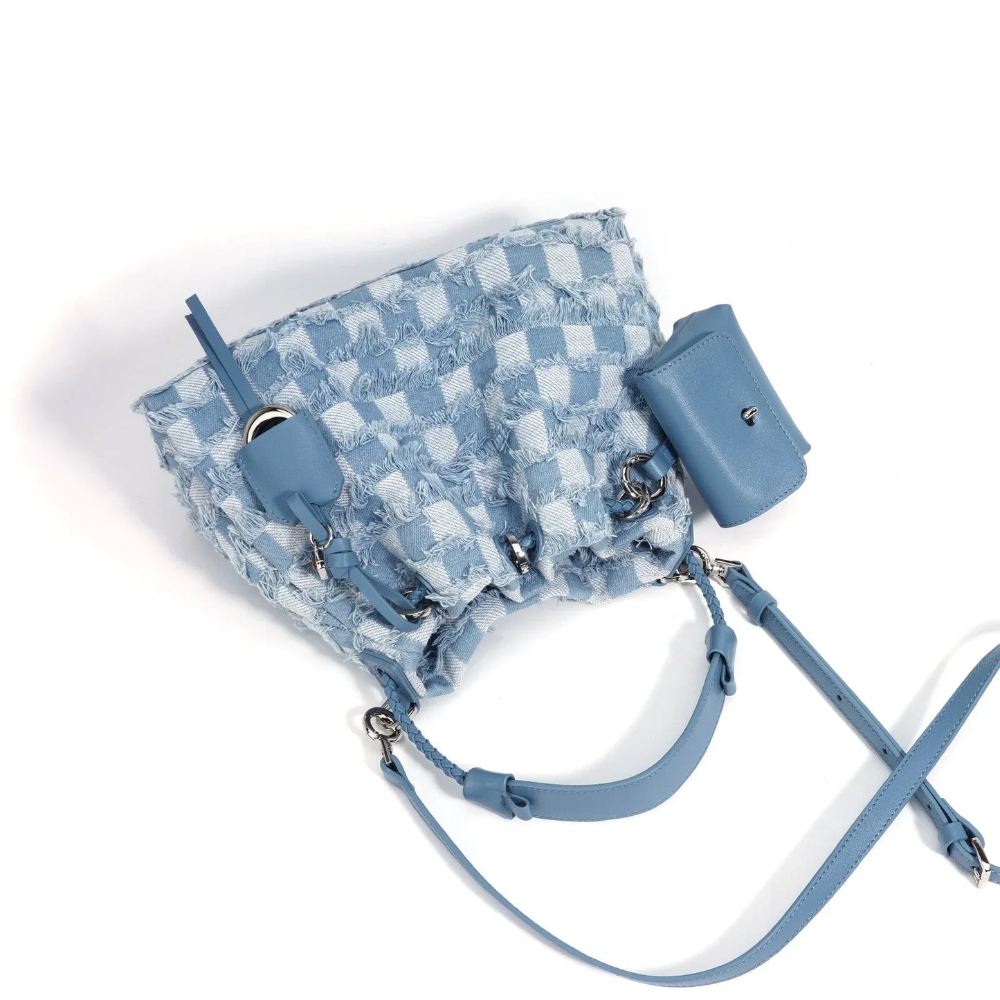 Light blue checkered drawstring bucket bag with leather strap and pouch on white background