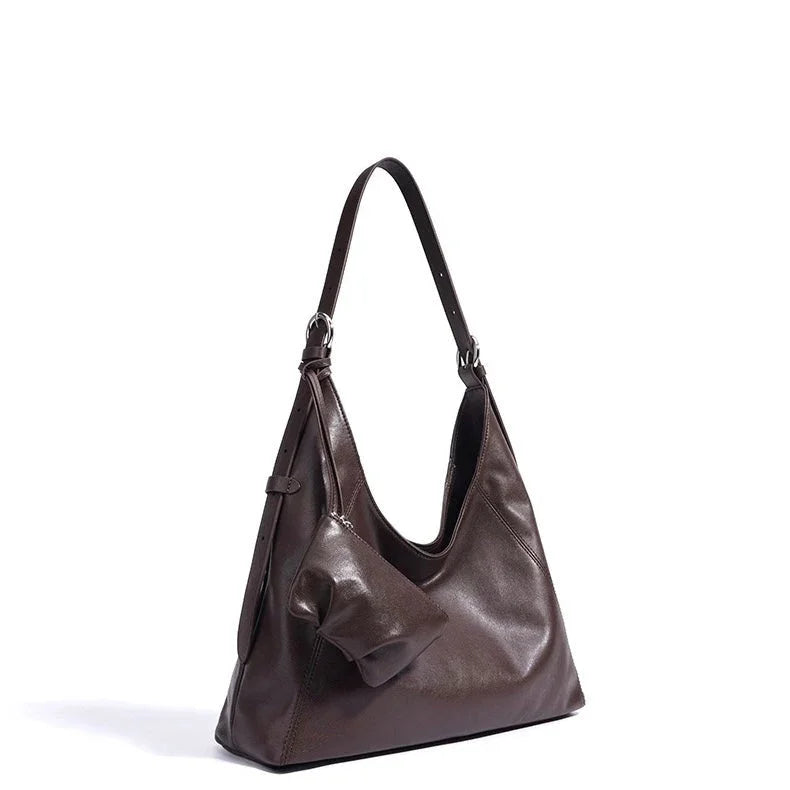 Dark brown leather shoulder bag with pouch on white background
