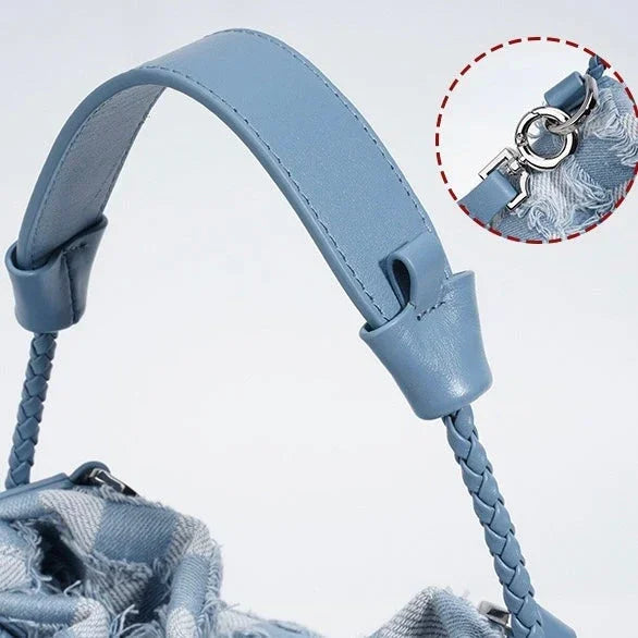 Light blue handbag handle with braided strap and detachable metal clasp detail