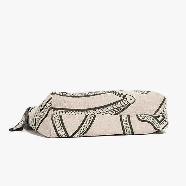 Beige canvas zipper pouch with black abstract line art pattern on white background