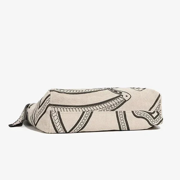 Beige canvas zipper pouch with black abstract line art pattern on white background