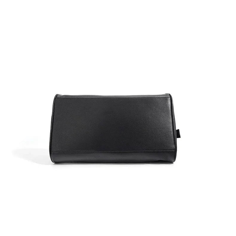 Black leather clutch bag on white background