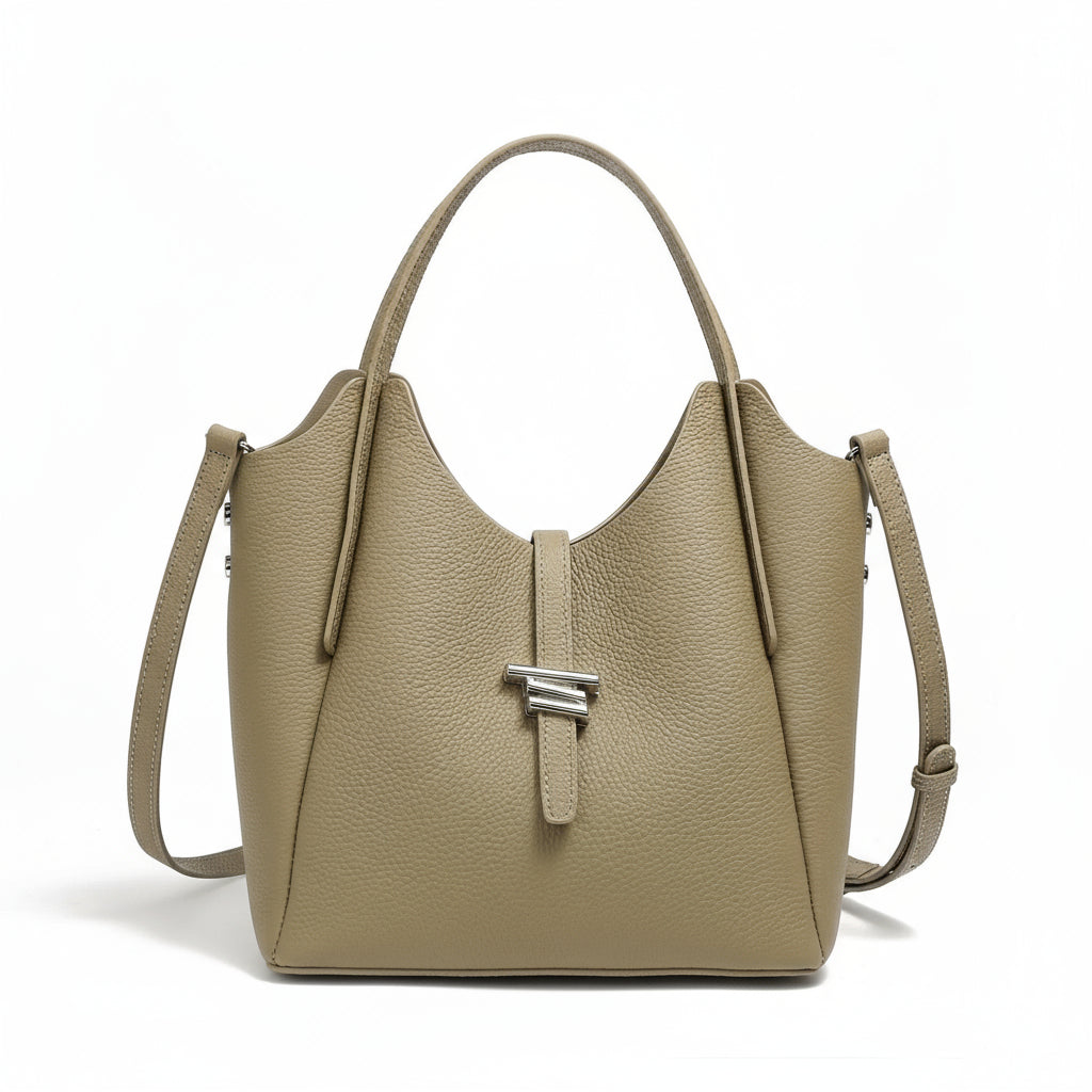 Taupe leather tote handbag with top handle, shoulder strap, and silver clasp on white background