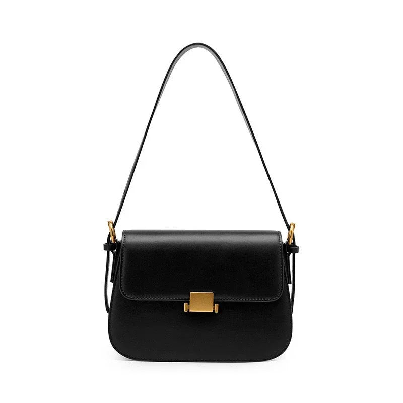 Black leather shoulder bag with gold buckle on white background