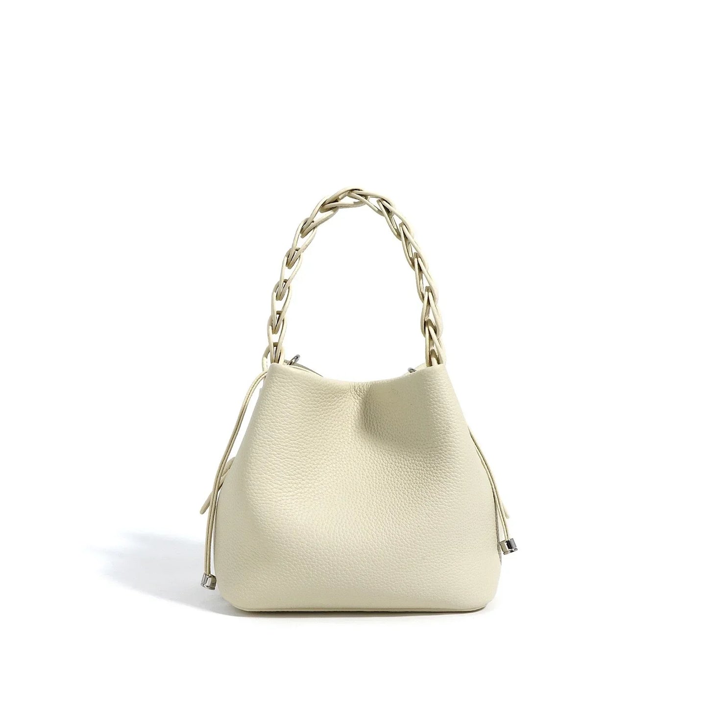 Cream leather bucket bag with braided handle and silver accents on a white background