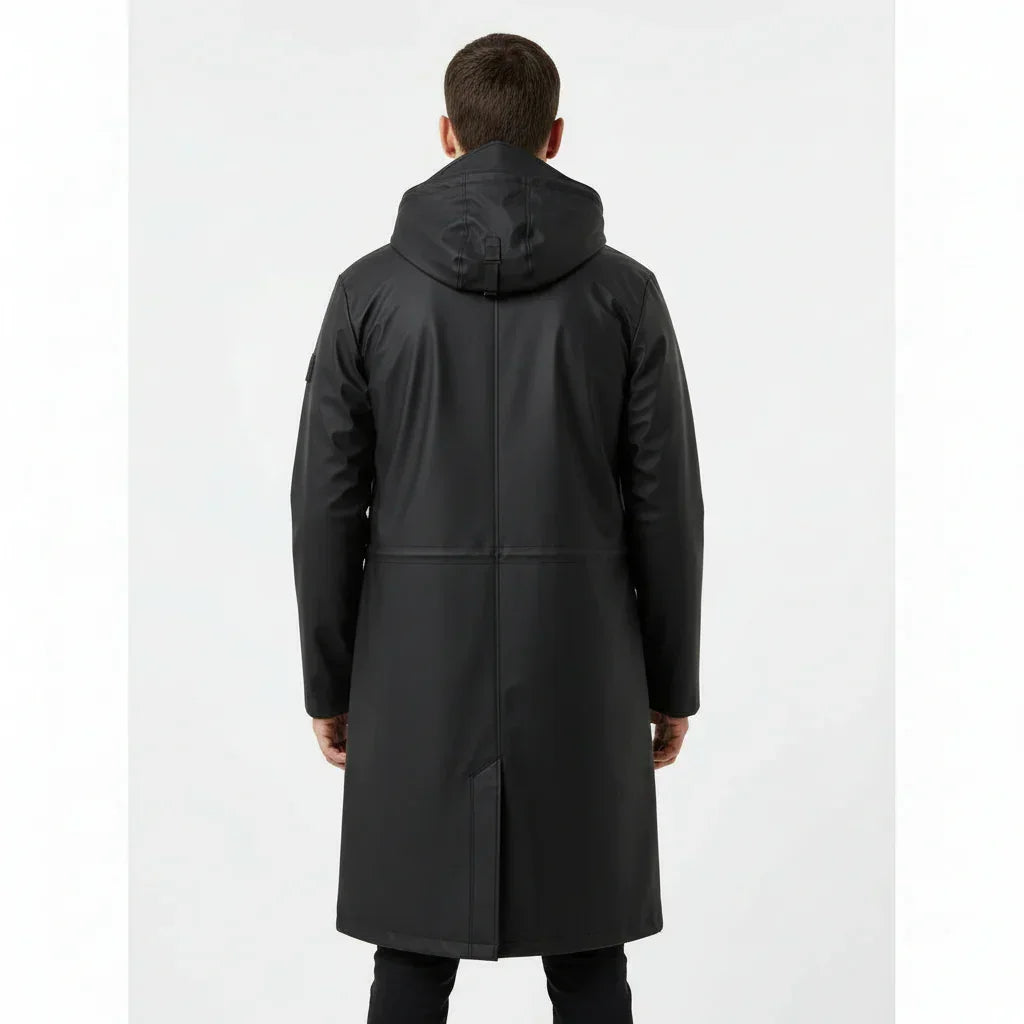 Man wearing a black raincoat on a white background