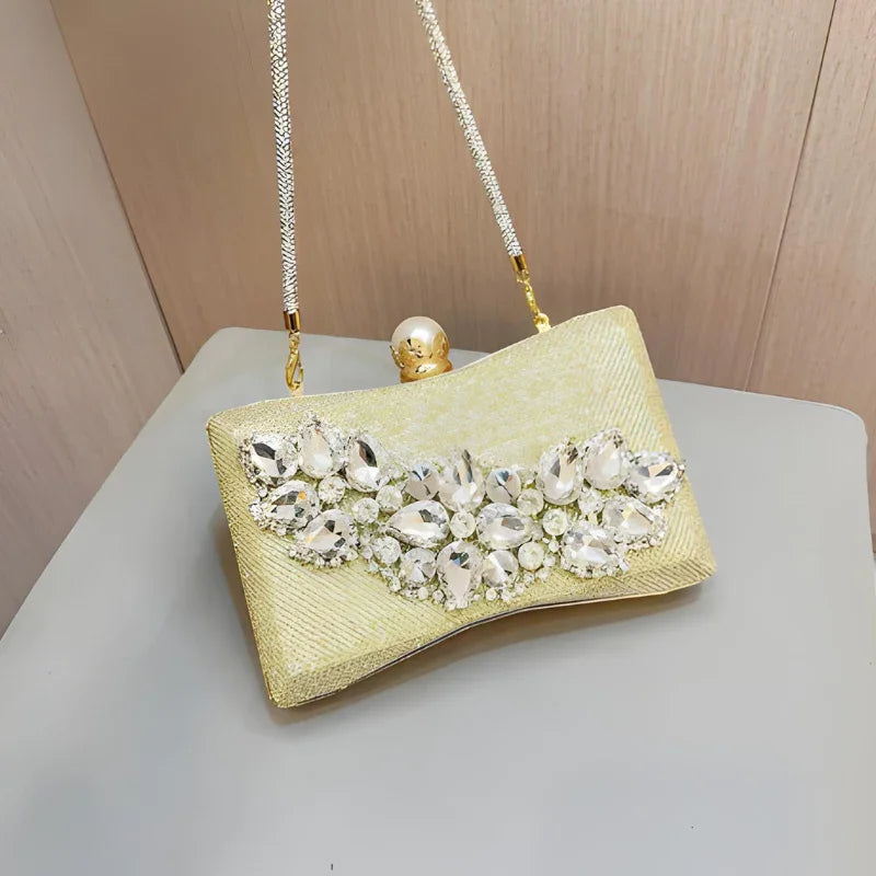 Gold evening clutch bag with crystal rhinestone embellishments and metallic chain strap