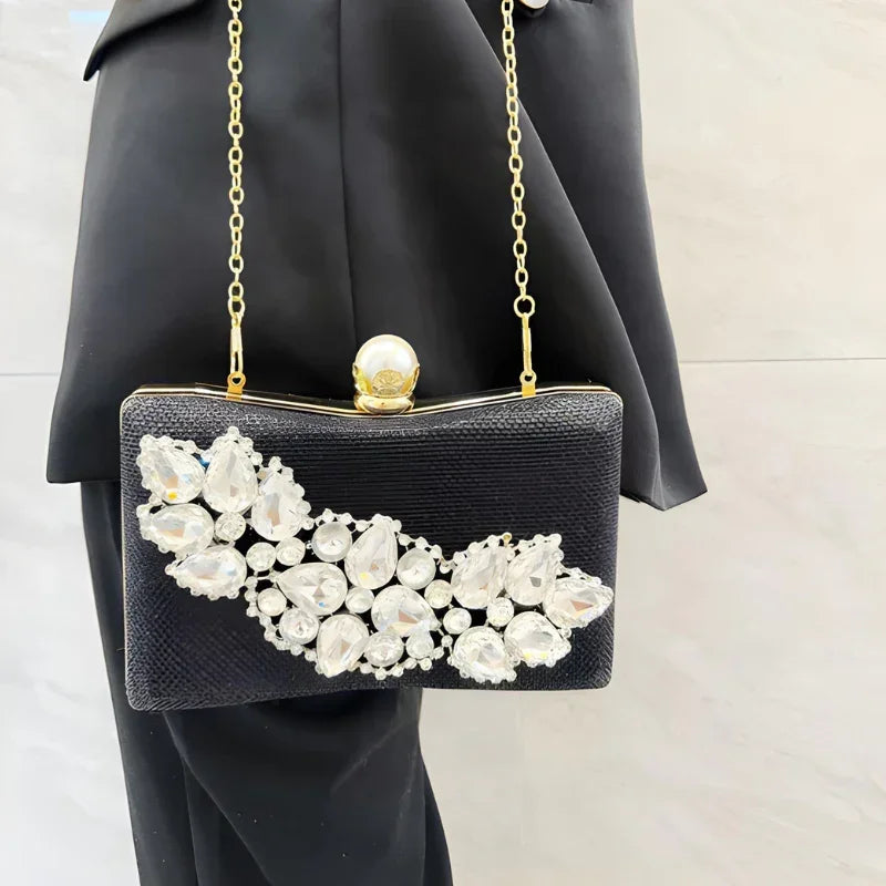 Black evening clutch purse with crystal embellishments and gold chain strap