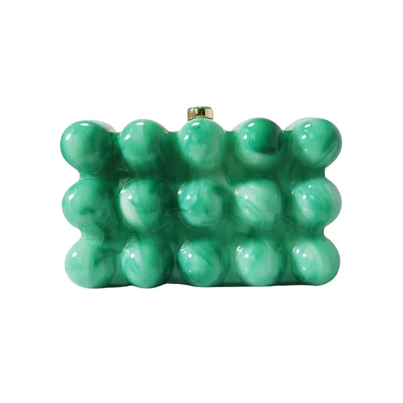 Green bubble clutch purse with glossy marble texture and gold clasp, displayed on white background