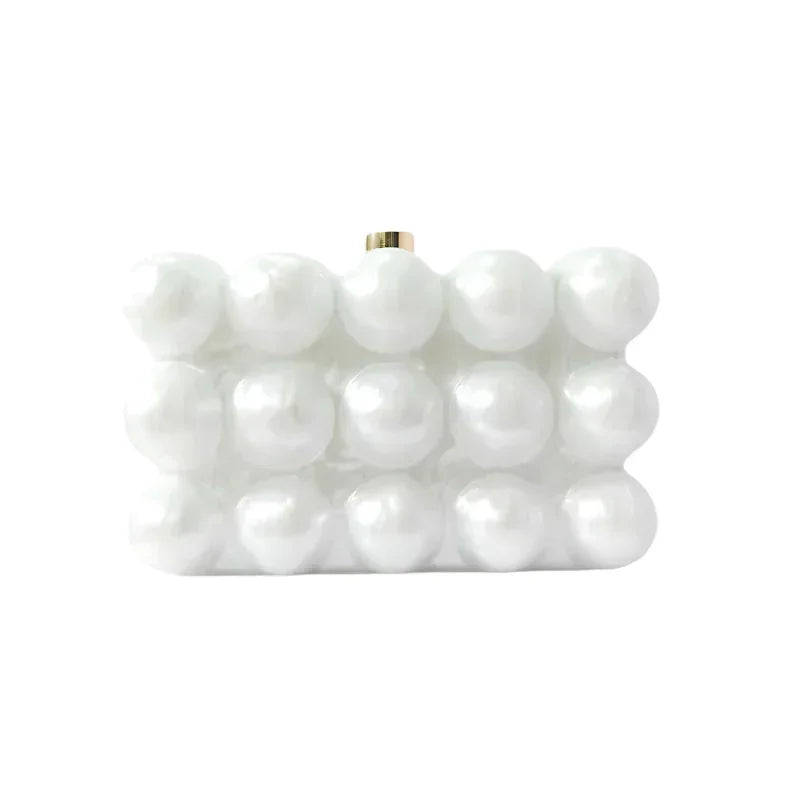 White pearl beaded clutch bag with rectangular shape on white background