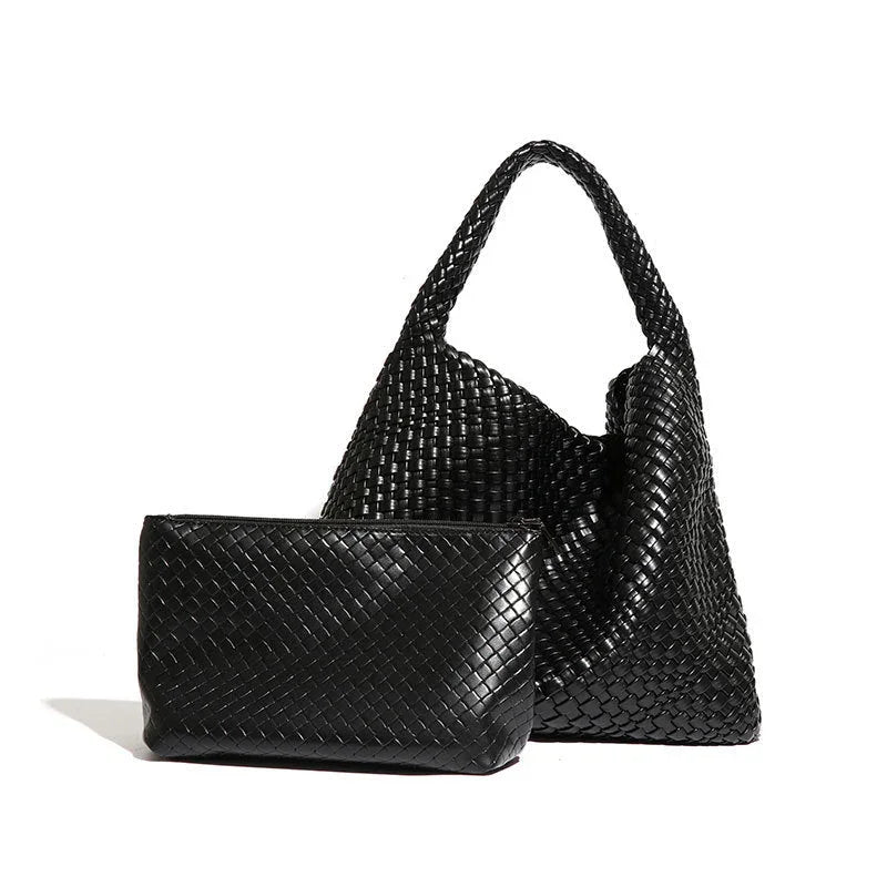 Black woven leather tote bag with matching zip pouch on white background