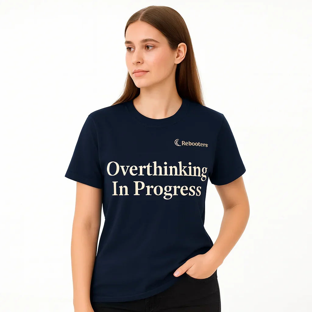 Person wearing a navy blue t-shirt with 'Overthinking In Progress' text on a white background