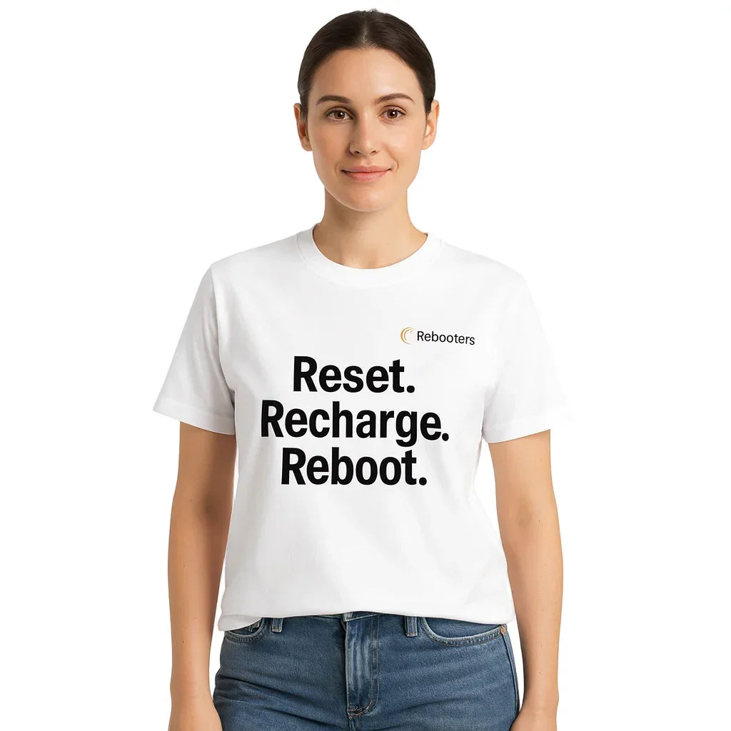 Person wearing a white t-shirt with 'Reset. Recharge. Reboot.' text and Rebooters logo.