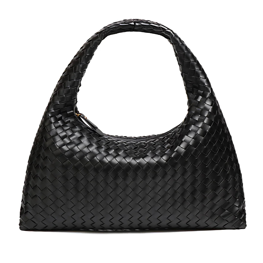 Black woven leather handbag with top handle on white background