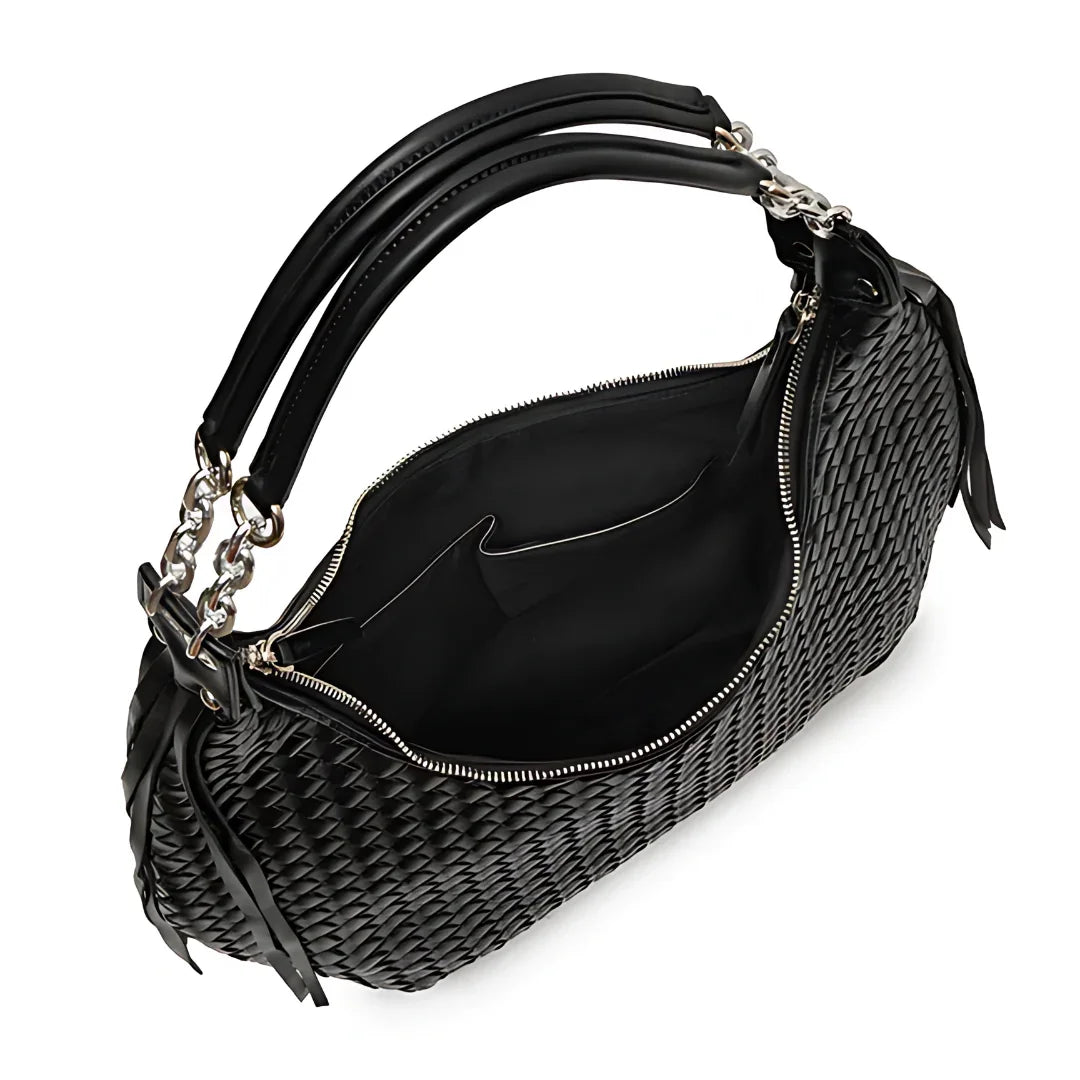 Black woven leather handbag with double handles and zipper, open to show spacious interior.