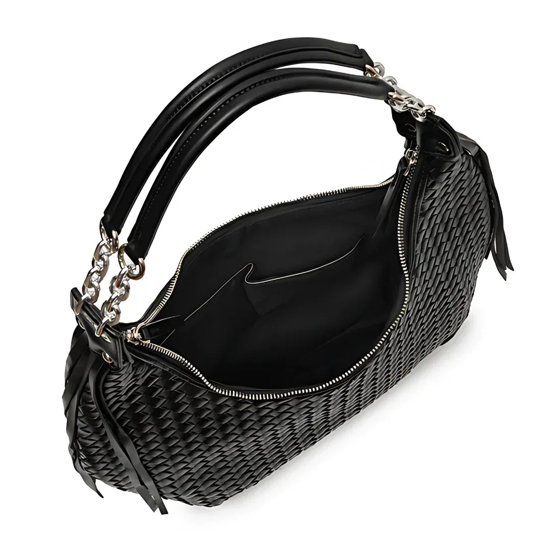 Black woven leather handbag with double handles and zipper, open to show spacious interior.