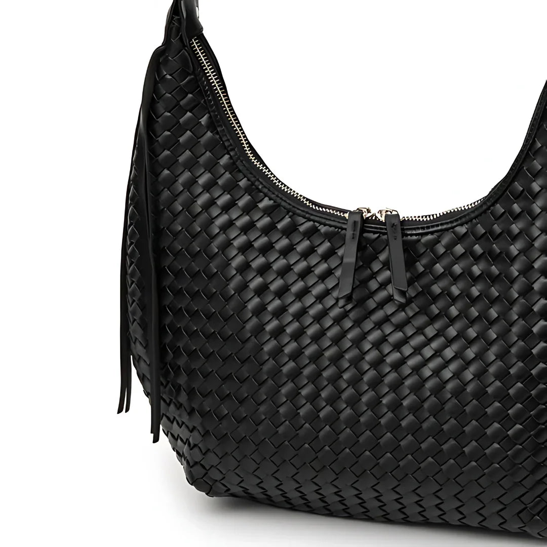 Black woven leather shoulder bag with zipper on white background
