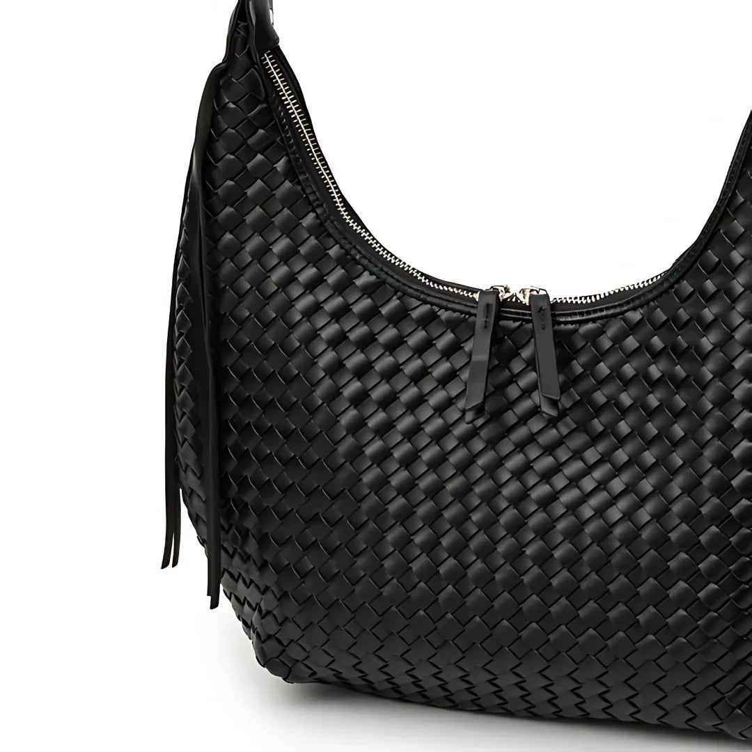 Black woven leather shoulder bag with zipper on white background