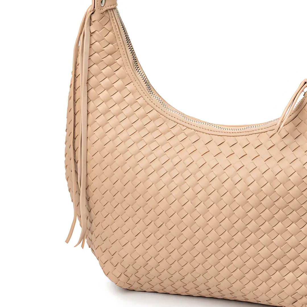 Beige woven leather shoulder bag with zipper detail and tassel accent