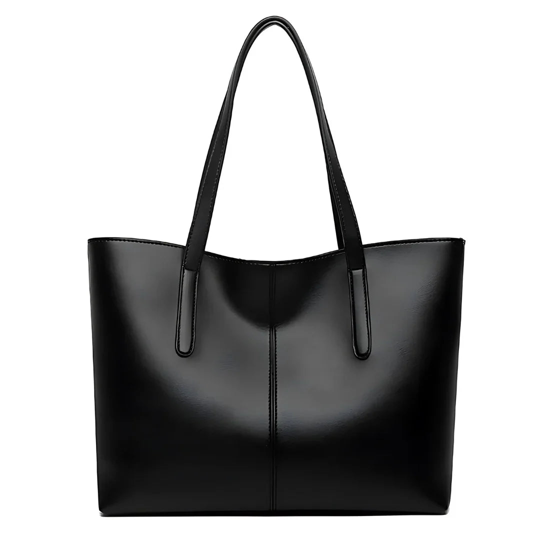 Black leather tote bag with double handles, minimalist and sleek design