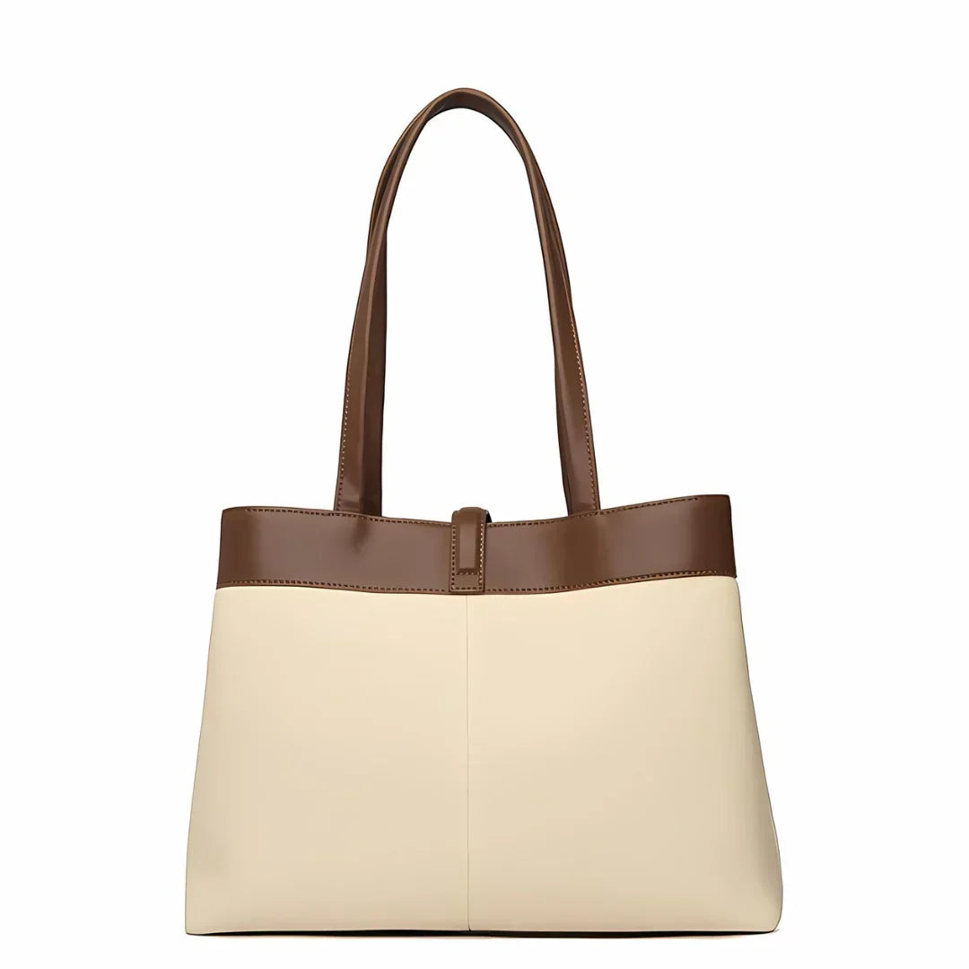Two-tone tote bag with brown handles and beige body on white background