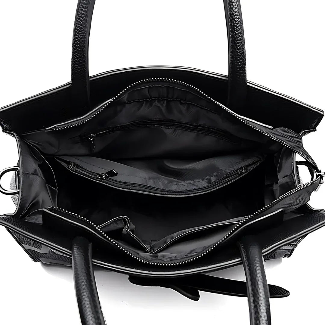 Black leather tote bag interior with zipper pockets and organized compartments