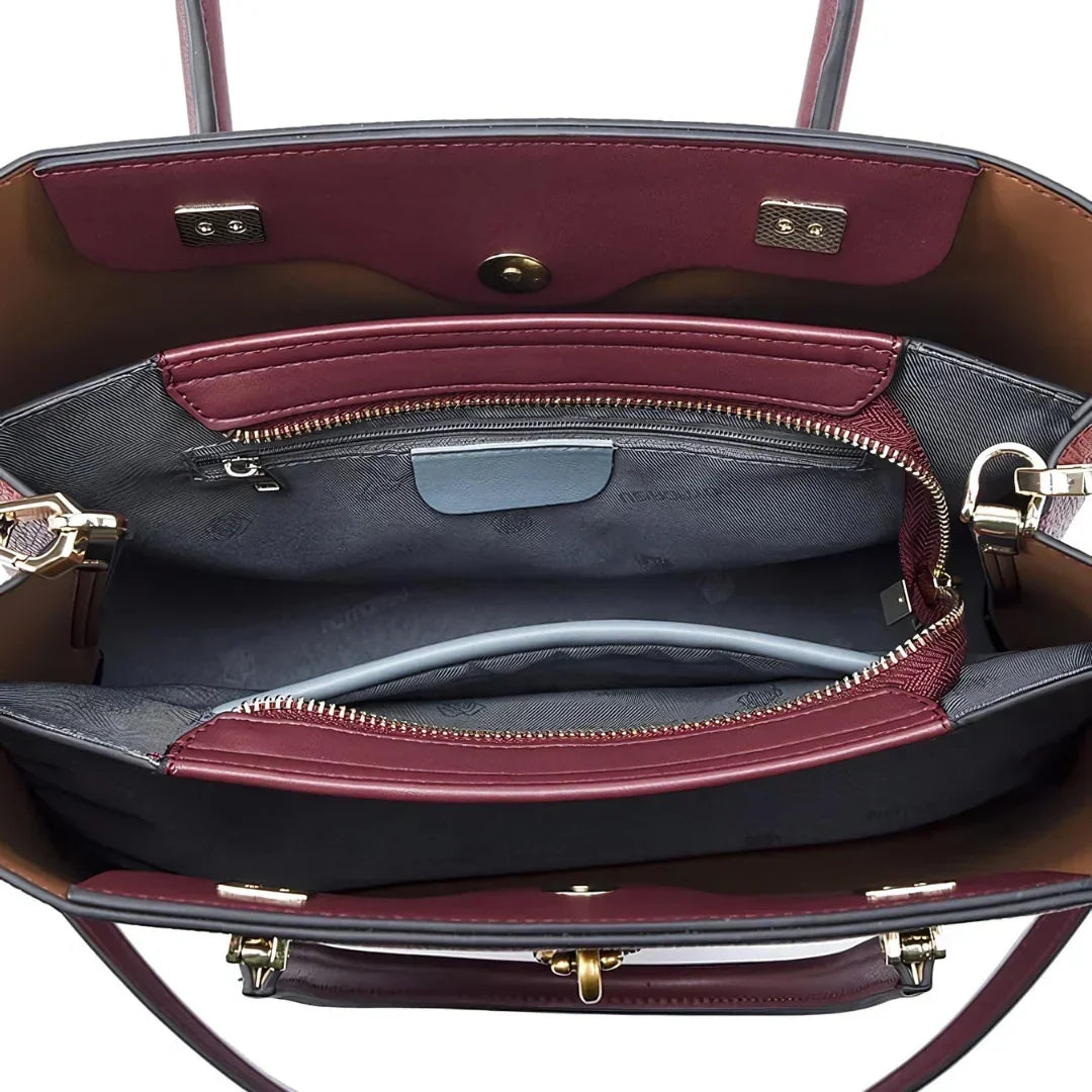 Open burgundy leather handbag with organized interior pockets and gold hardware