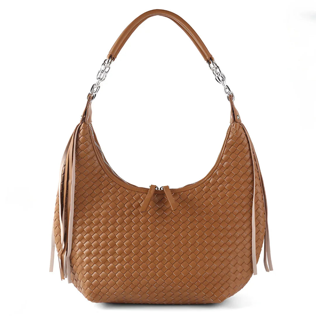 Woven brown leather shoulder bag with tassel accents and silver chain details