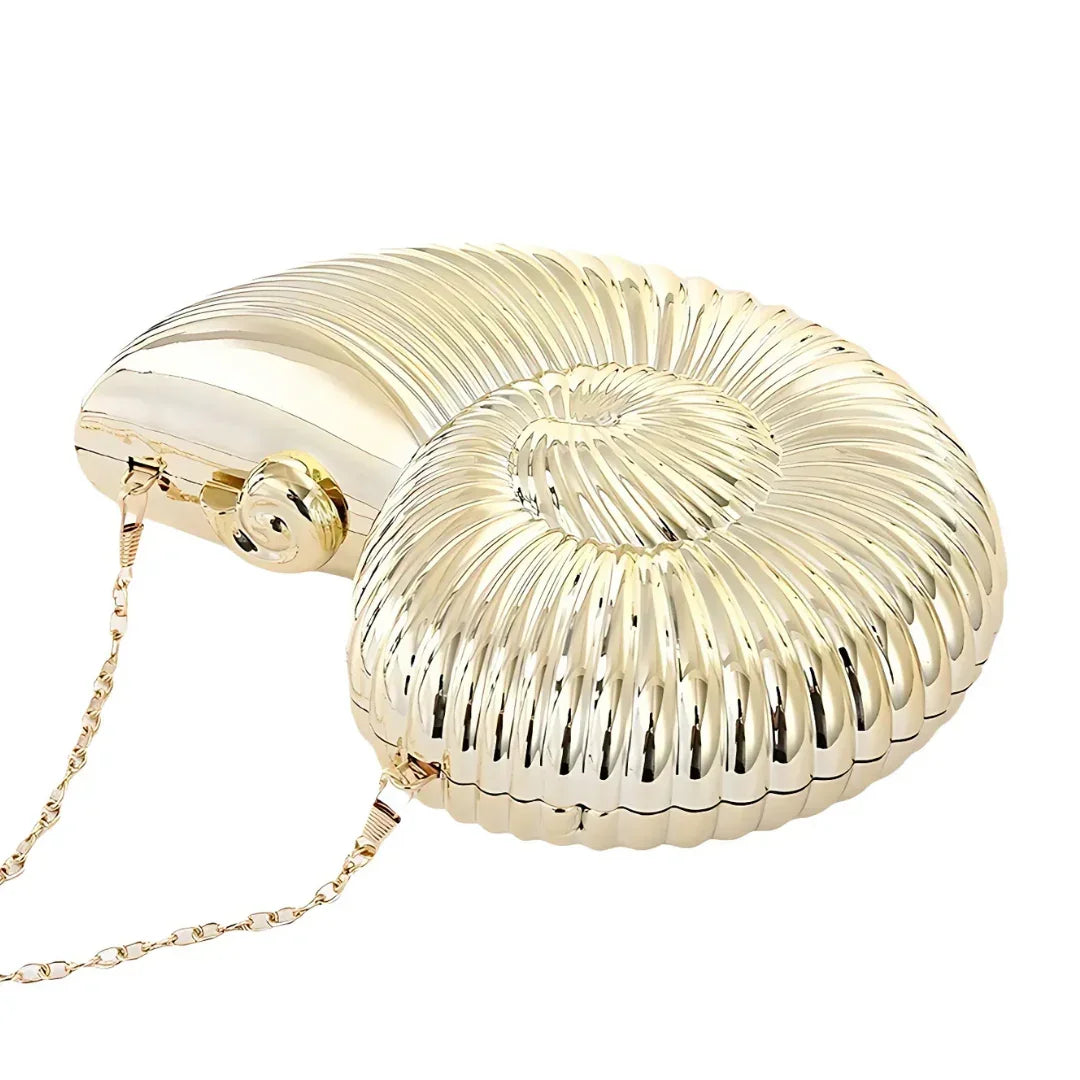 Gold seashell-shaped clutch bag with metallic finish and chain strap