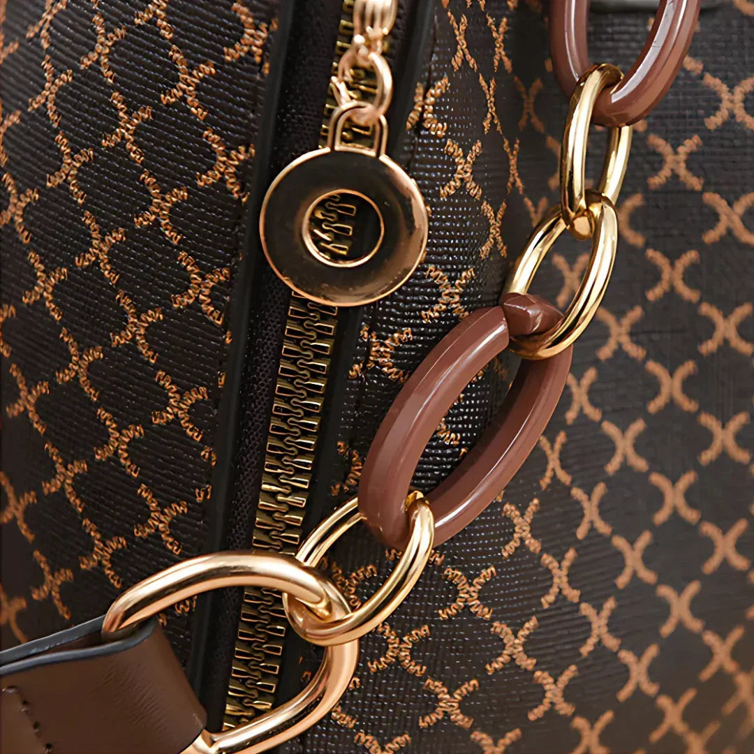 Brown geometric pattern handbag with gold zipper and chain detail