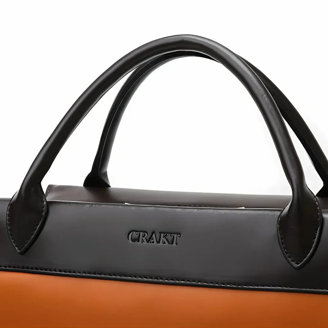 CRAKT black and brown leather handbag with dual handles, close-up view
