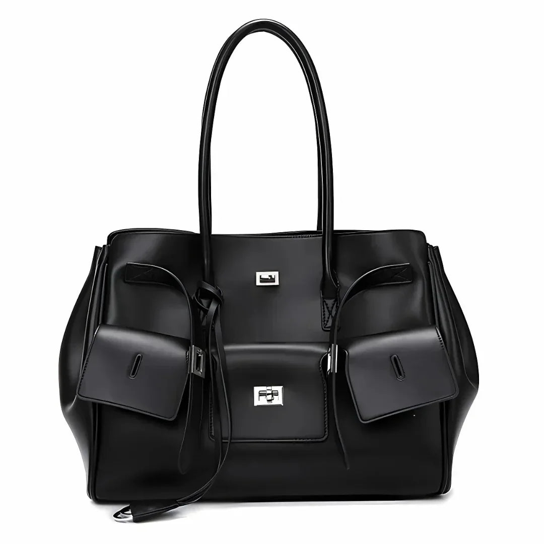 Black leather tote bag with silver hardware, front pockets, and double handles