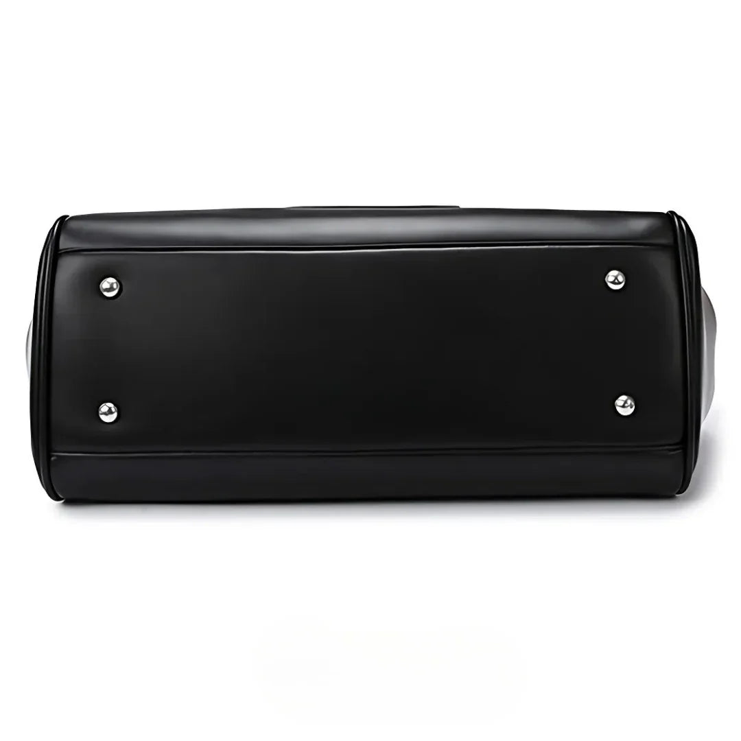 Black faux leather bag bottom with metal feet, clean minimalist design